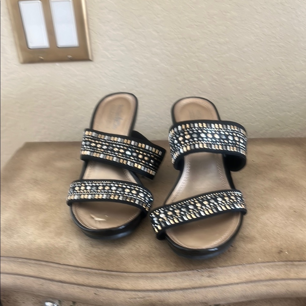 Coach and Four Black Sandals with Decorative Straps and Flat Sole